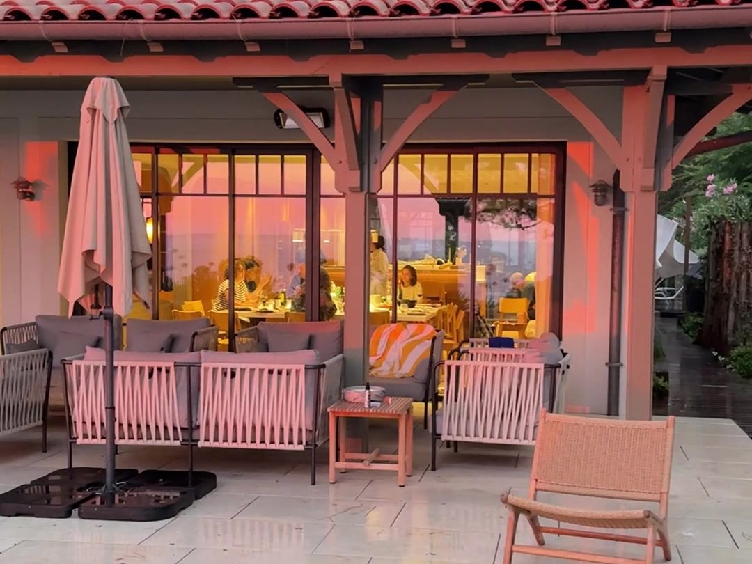 An evening table laid on the terrace of a villa on Arcachon Bay